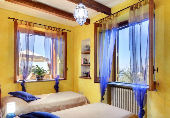 bright twin bedroom, primula apartment, casale la torre residence, massa lubrense, italy