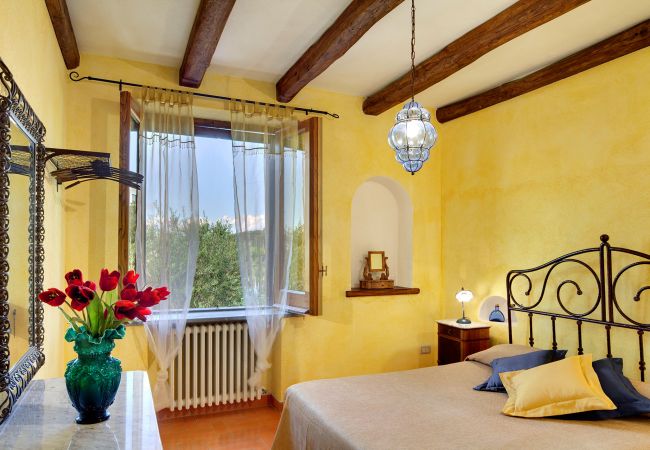 double bedroom with wide window, casale la torre, holiday apartments near sorrento, massa lubrense, italy