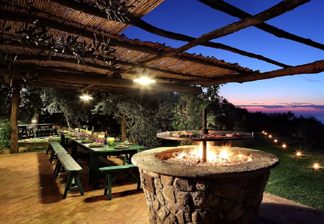 bbq and picnic area at sunset, casale la torre, holiday apartments near sorrento, massa lubrense, italy