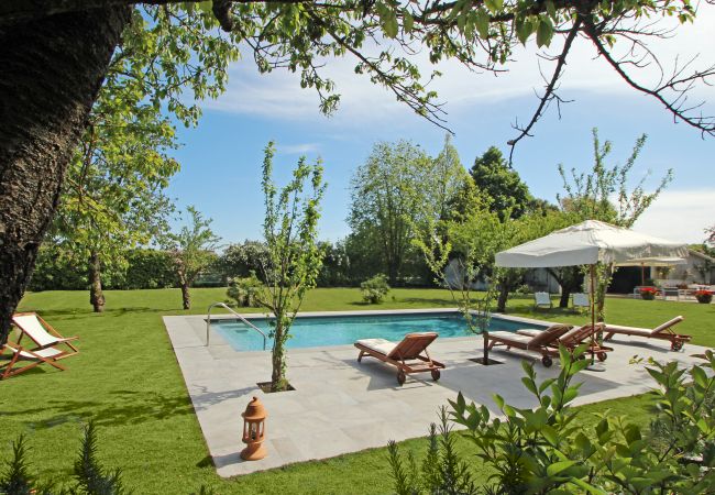 wide solarium with sunbeds and pool, villa la casa bianca, massa lubrense, italy