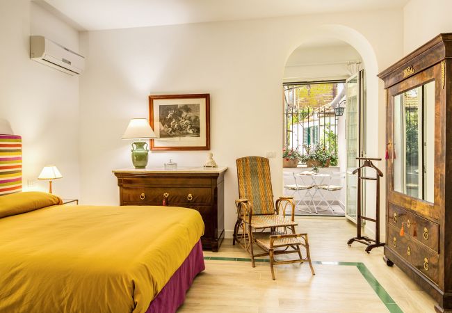 classic double bedroom with opened window, vacation villa la casa bianca, massa lubrense, italy