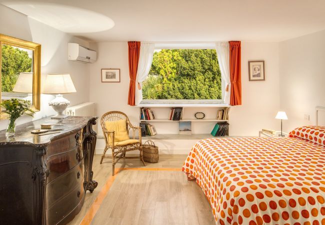 double bedroom with two panoramic windows, vacation villa la casa bianca, massa lubrense, italy