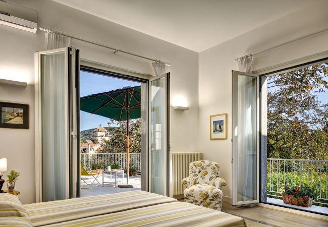 panoramic double bedroom, two opened balconies, vacation villa la casa bianca, massa lubrense, italy