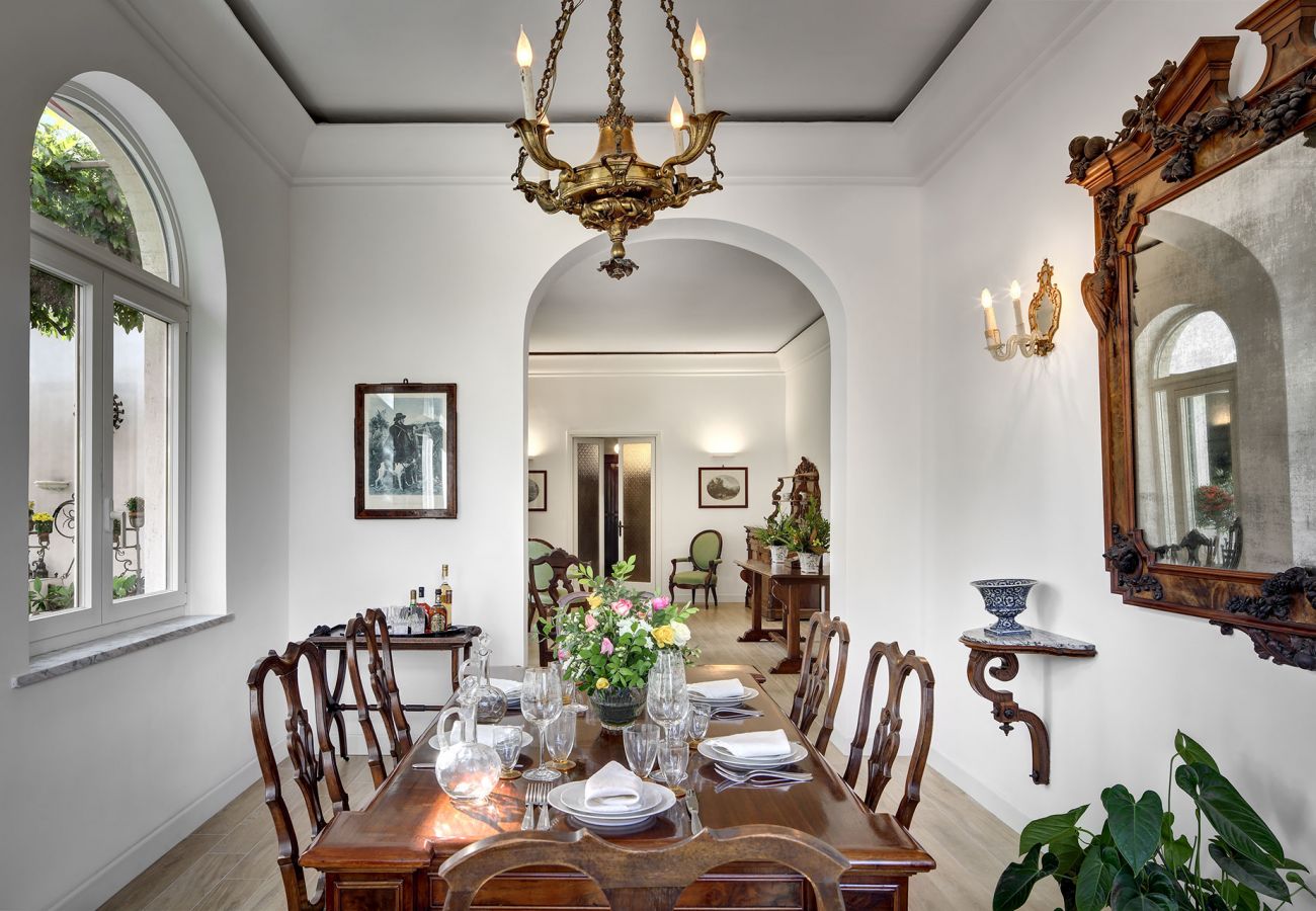 bright dining room with table and chairs, vacation villa la casa bianca, massa lubrense, italy