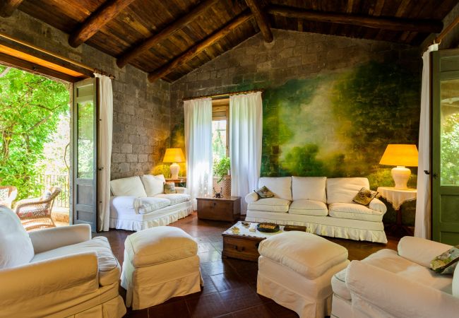 wide living room, white furniture, villa mellicata, massa lubrense, italy