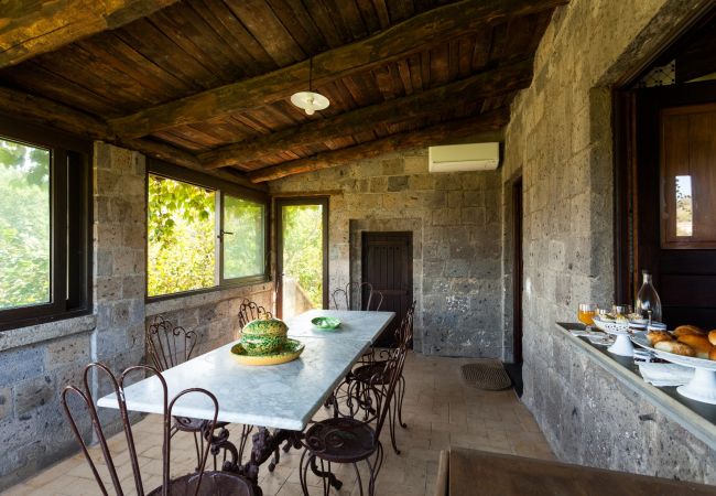 rustic veranda with iron table and chairs, villa mellicata, massa lubrense, italy