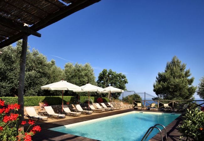 swimming pool, wide furnished soarium, sunny day, holiday apartment turandot, sant’agata sui due golfi, italy