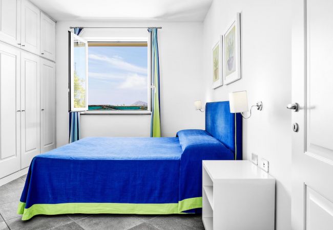 bright double bedroom with opened window, holiday apartment tosca, sant’agata sui due golfi, italy
