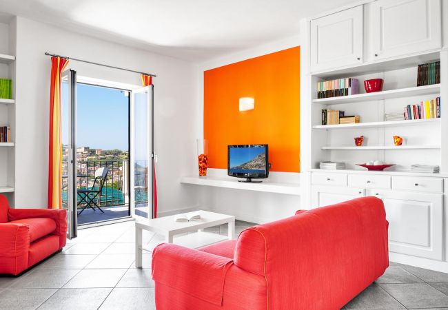 bright living room, in orange, boheme holiday apartment of le capannelle residence