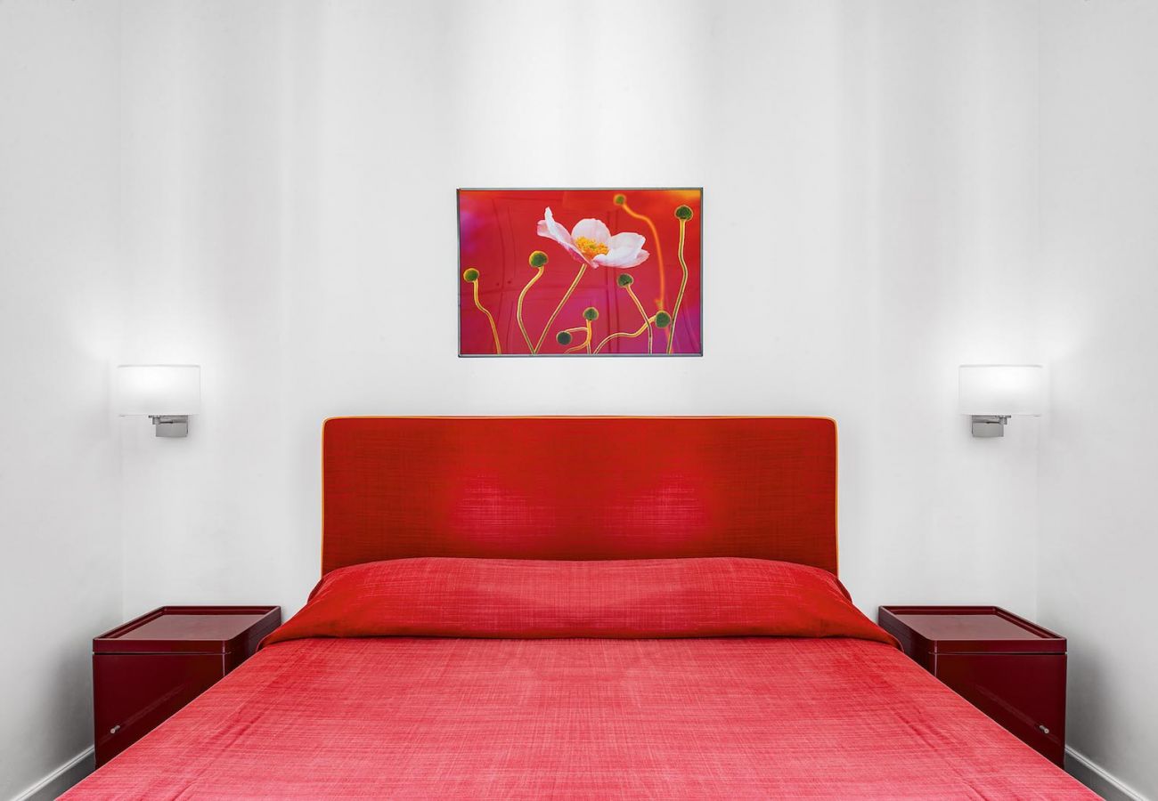 double bedroom with red bedroom and furnitures, boheme apt