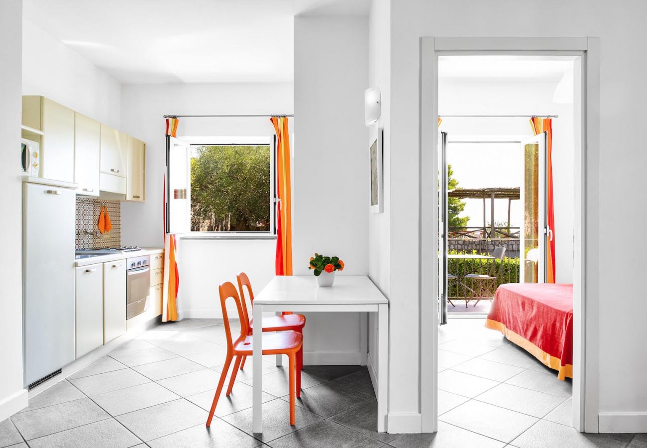 kitchen corner and double bedroom with balcony, boheme apartment